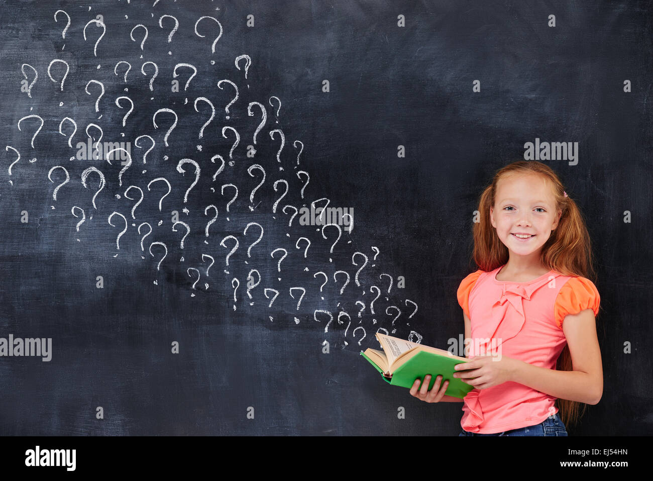 Cherful encoereged primary school age girl recieving answers Stock Photo