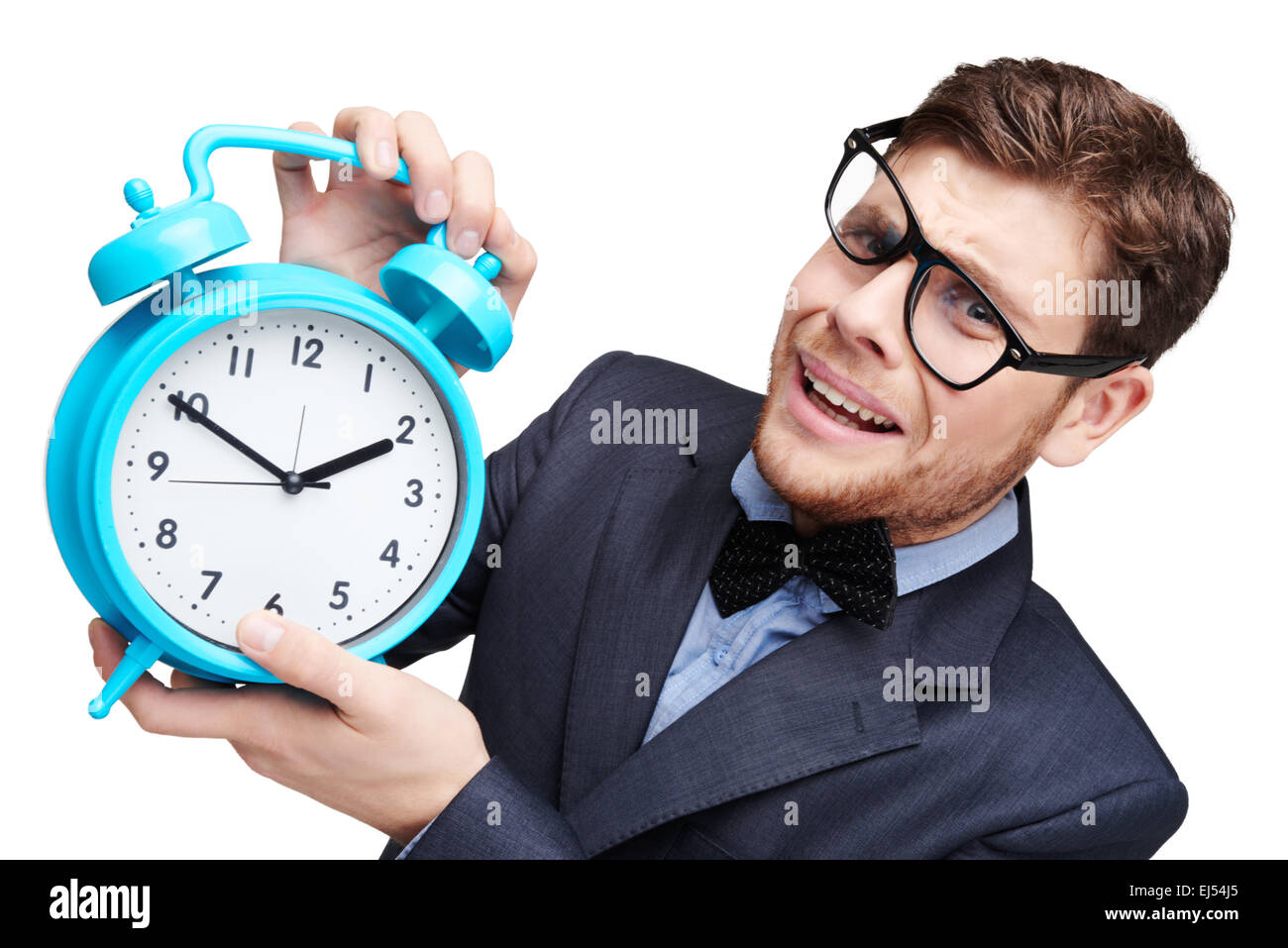 Young afraid man holding alarm clock Stock Photo Alamy