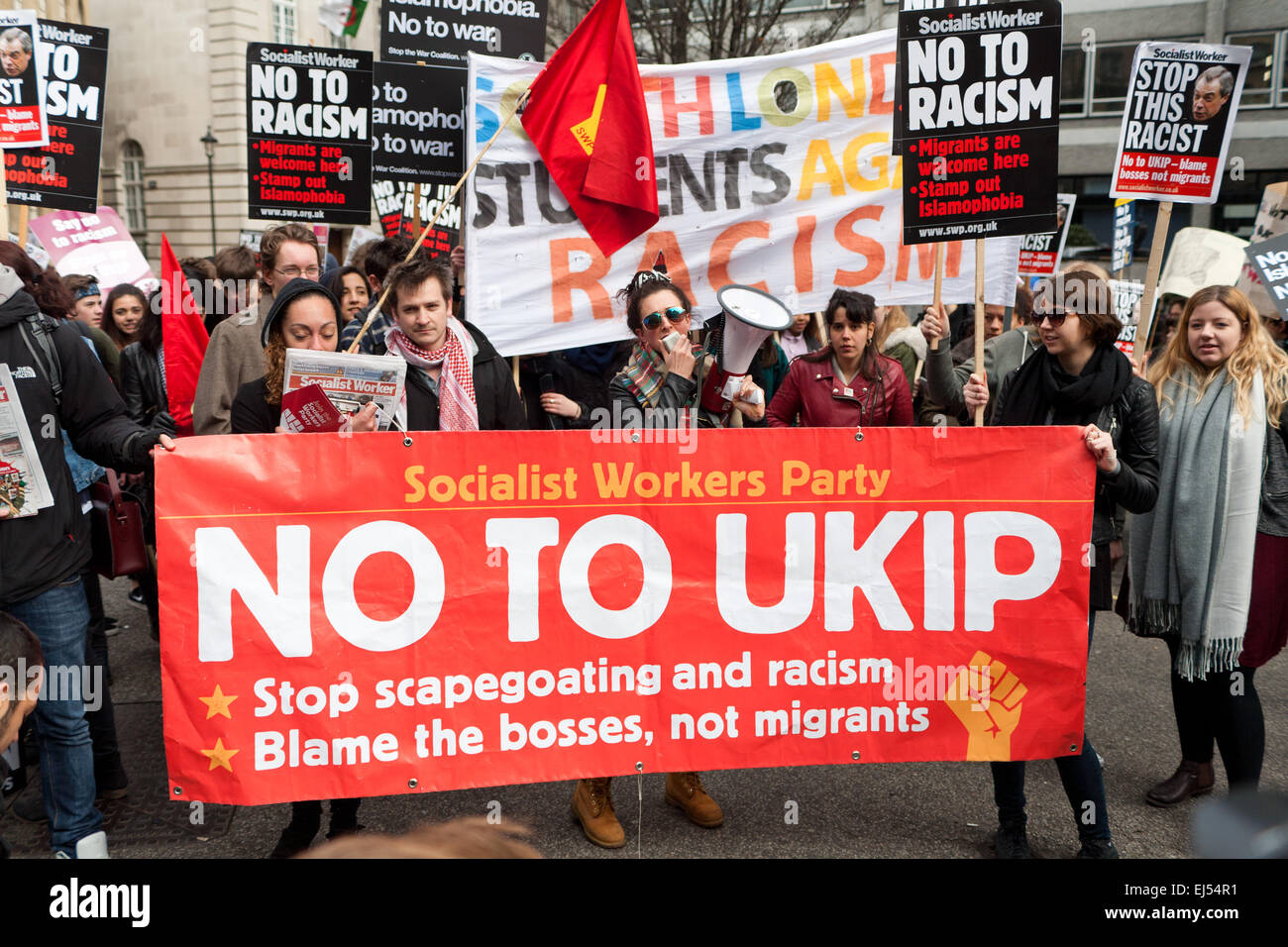 London, UK. 21st March, 2015.   protester  with banner at the Stand up to racism and fascism Protest London, . Credit:  Peter Barbe/Alamy Live News Stock Photo