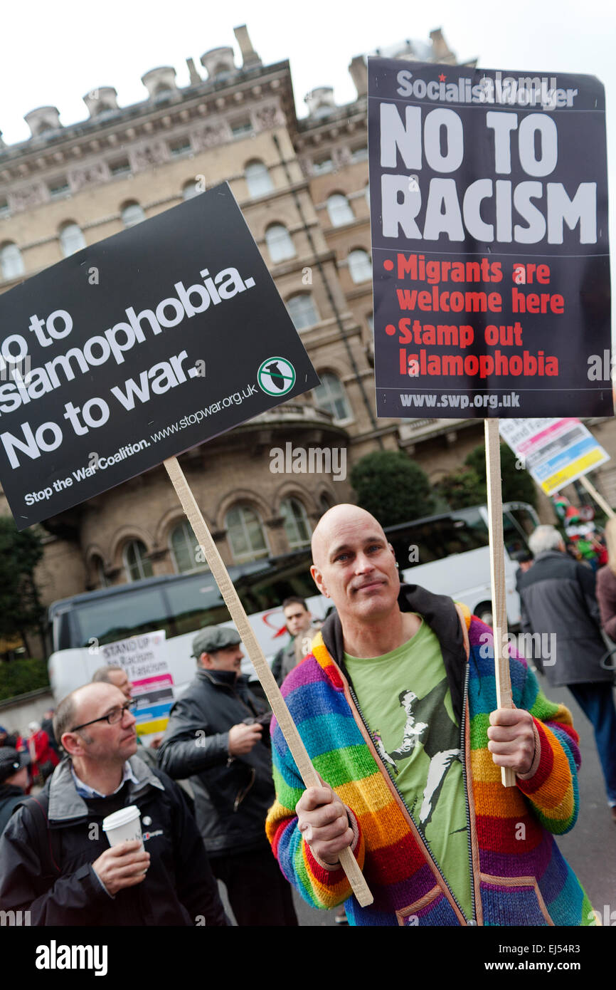 London, UK. 21st March, 2015.   protester standing placard at the Stand up to racism and fascism Protest London,  Credit:  Peter Barbe/Alamy Live News Stock Photo