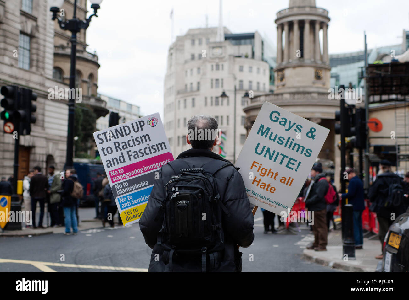 London, UK. 21st March, 2015.   protester standing placard at the Stand up to racism and fascism Protest London,  Credit:  Peter Barbe/Alamy Live News Stock Photo