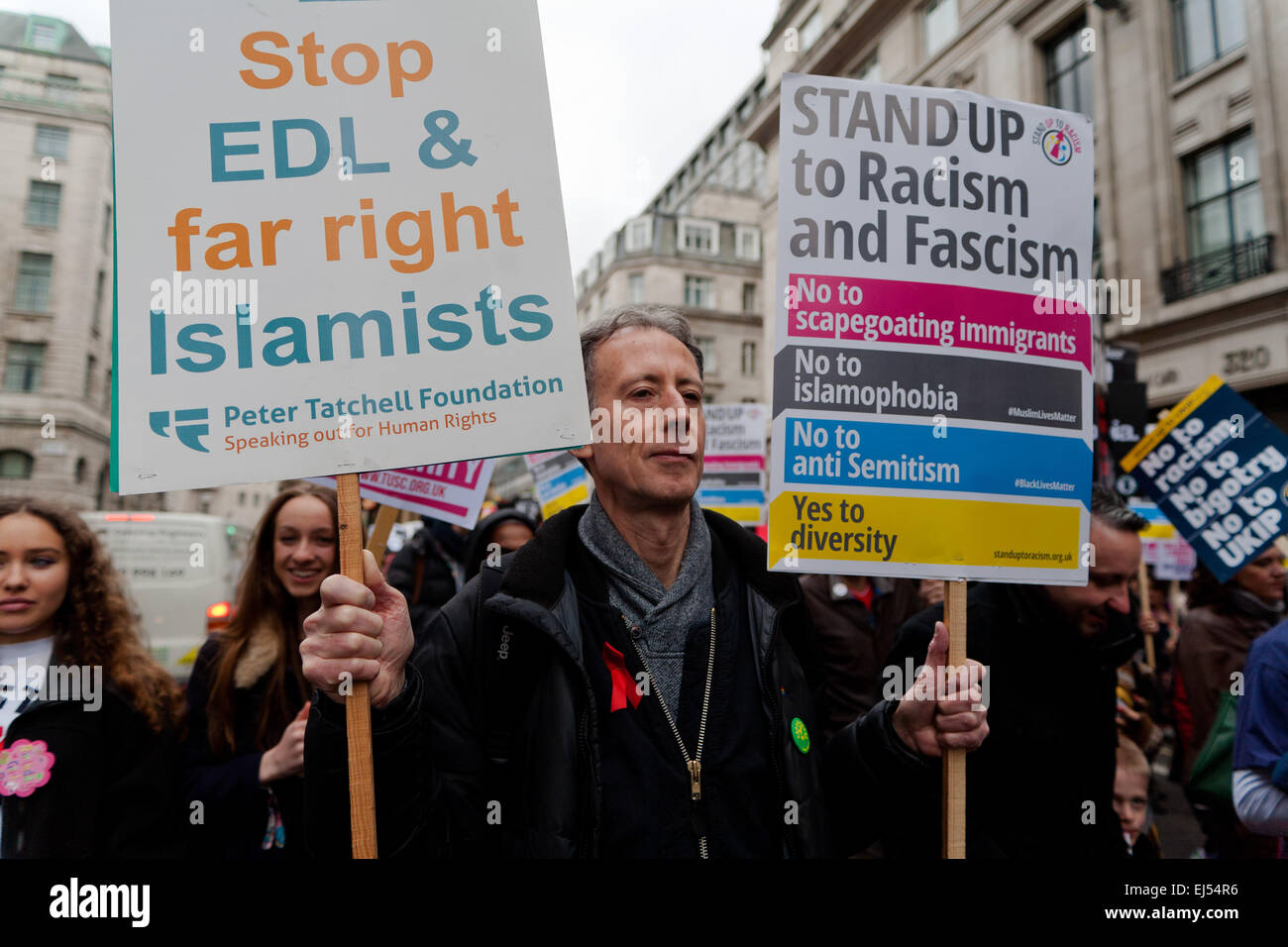 London, UK. 21st March, 2015.   Peter Tatchell pictured with placard at the Stand up to racism and fascism Protest London,  Credit:  Peter Barbe/Alamy Live News Stock Photo