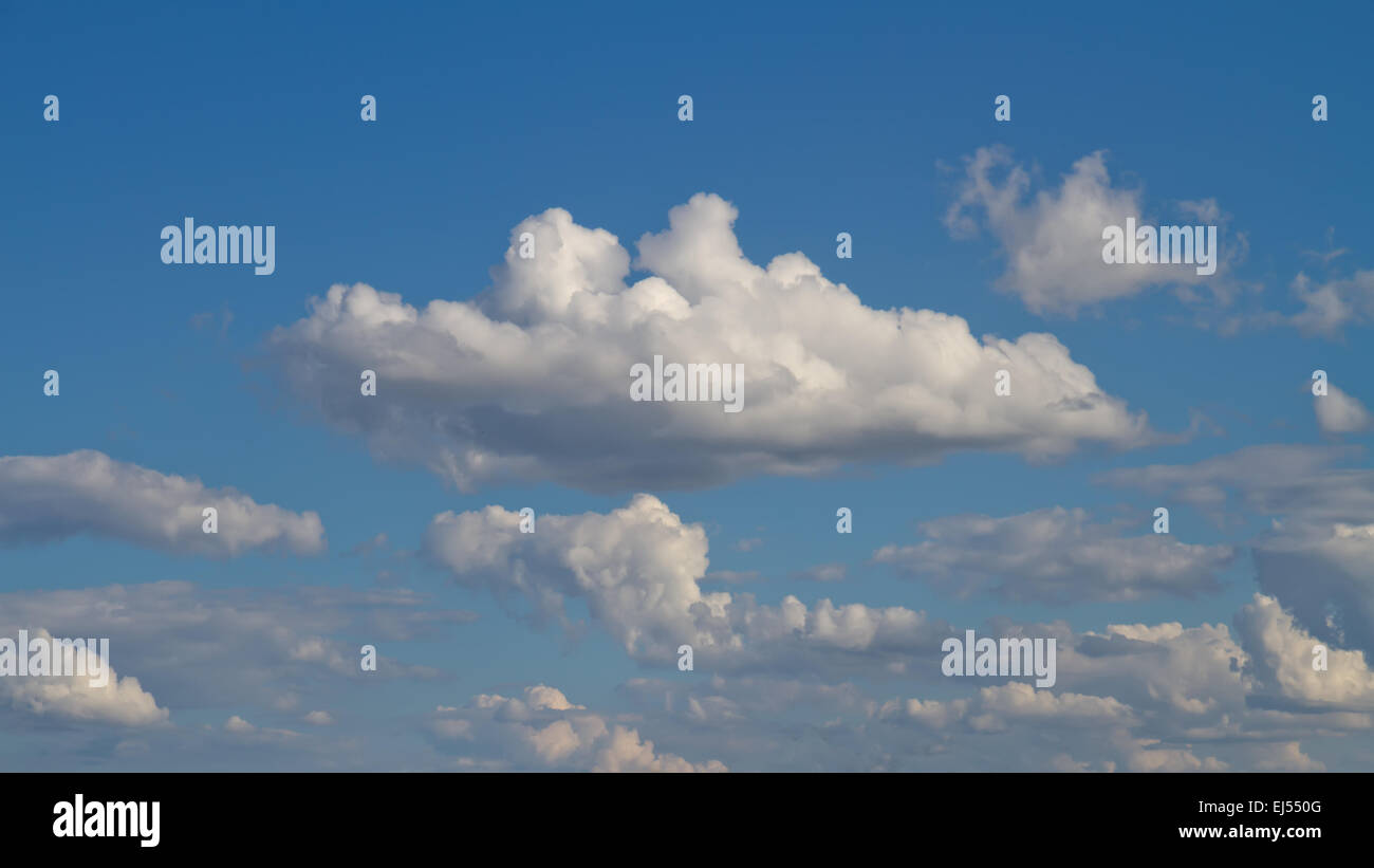 Blue sky with white clouds background image Stock Photo - Alamy