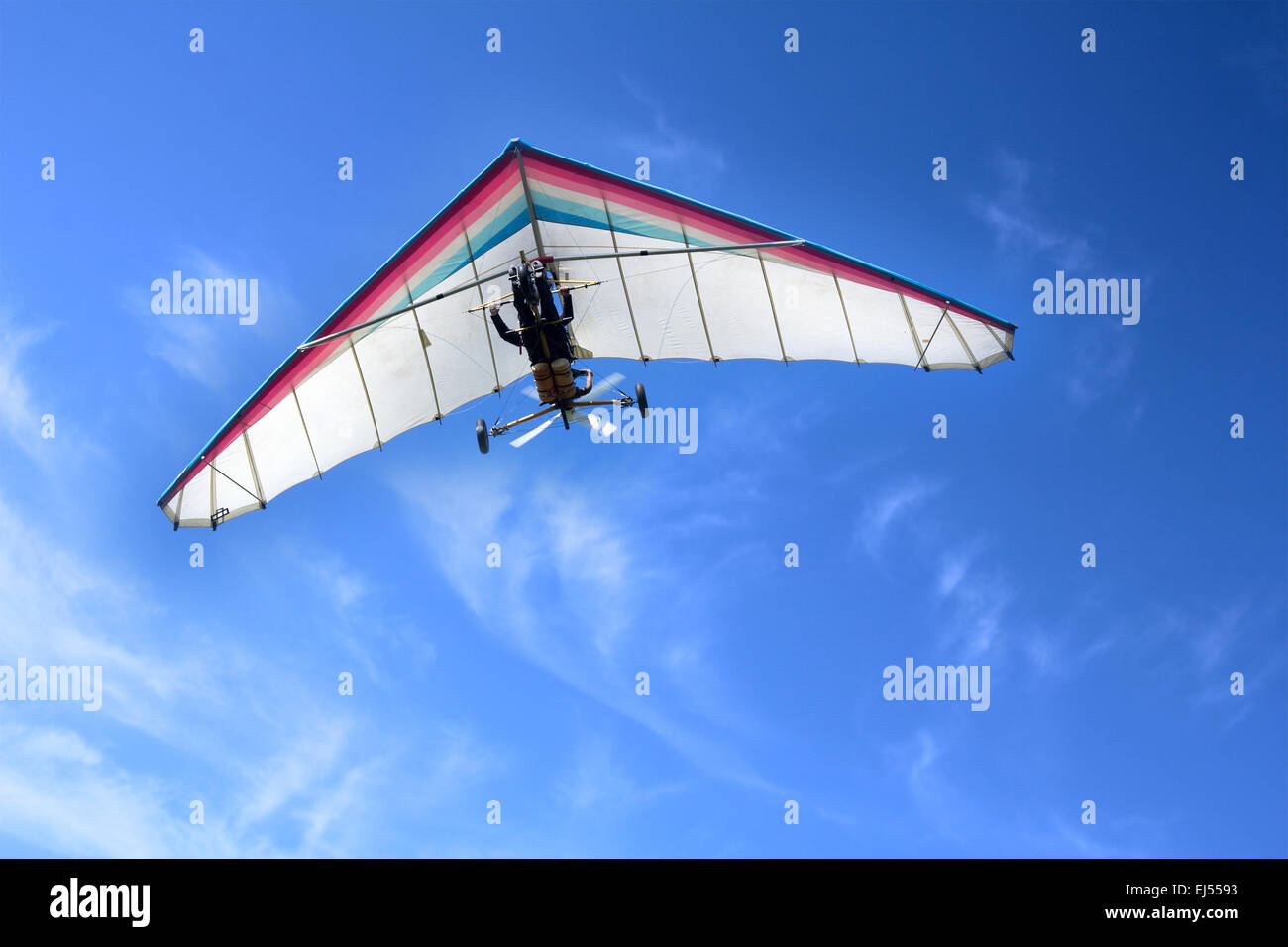 The motorized hang glider in the blue sky Stock Photo Alamy