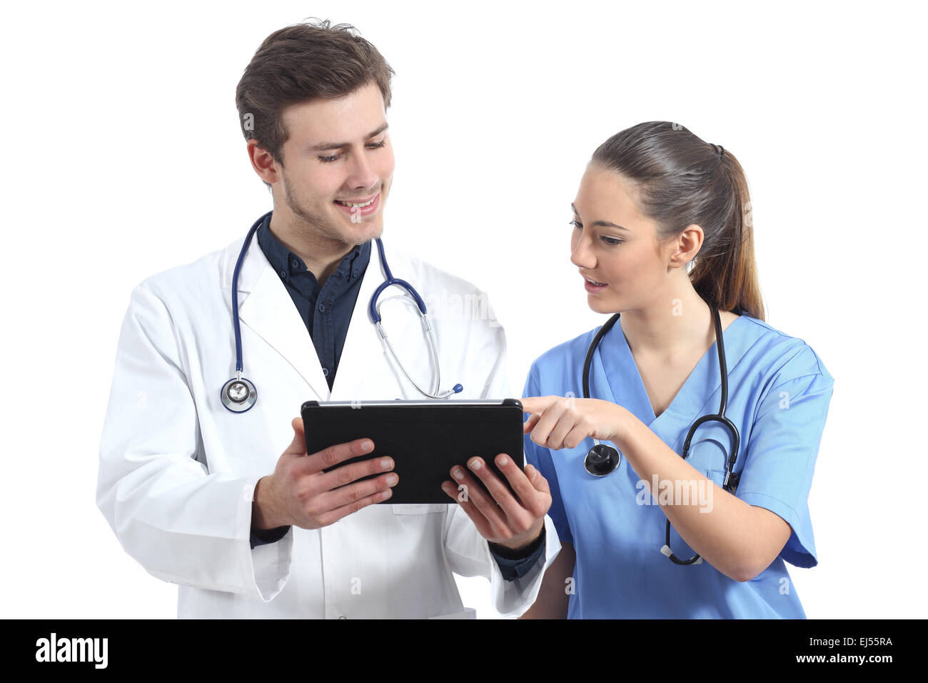 Doctor and nurse student working with a tablet isolated on a white
