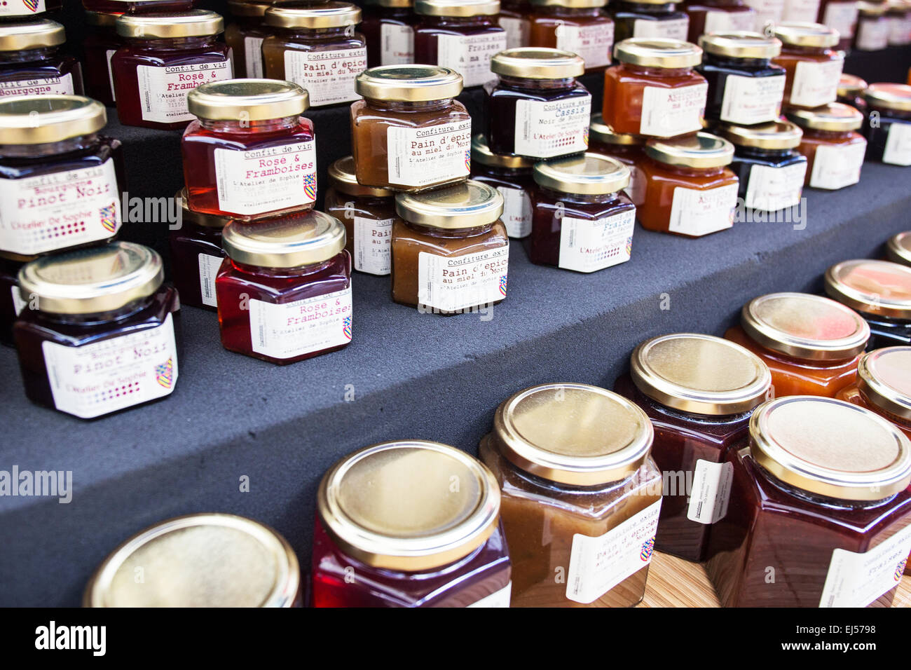 Jars of jam and marmalade on sale at a farmers market in Beaune