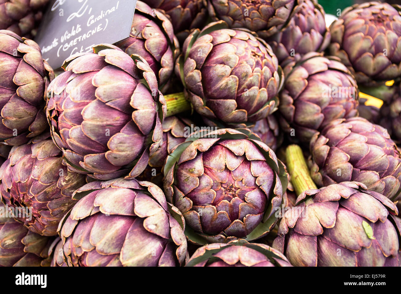 Artichokes on a market stall at the Saturday market in Beaune, France