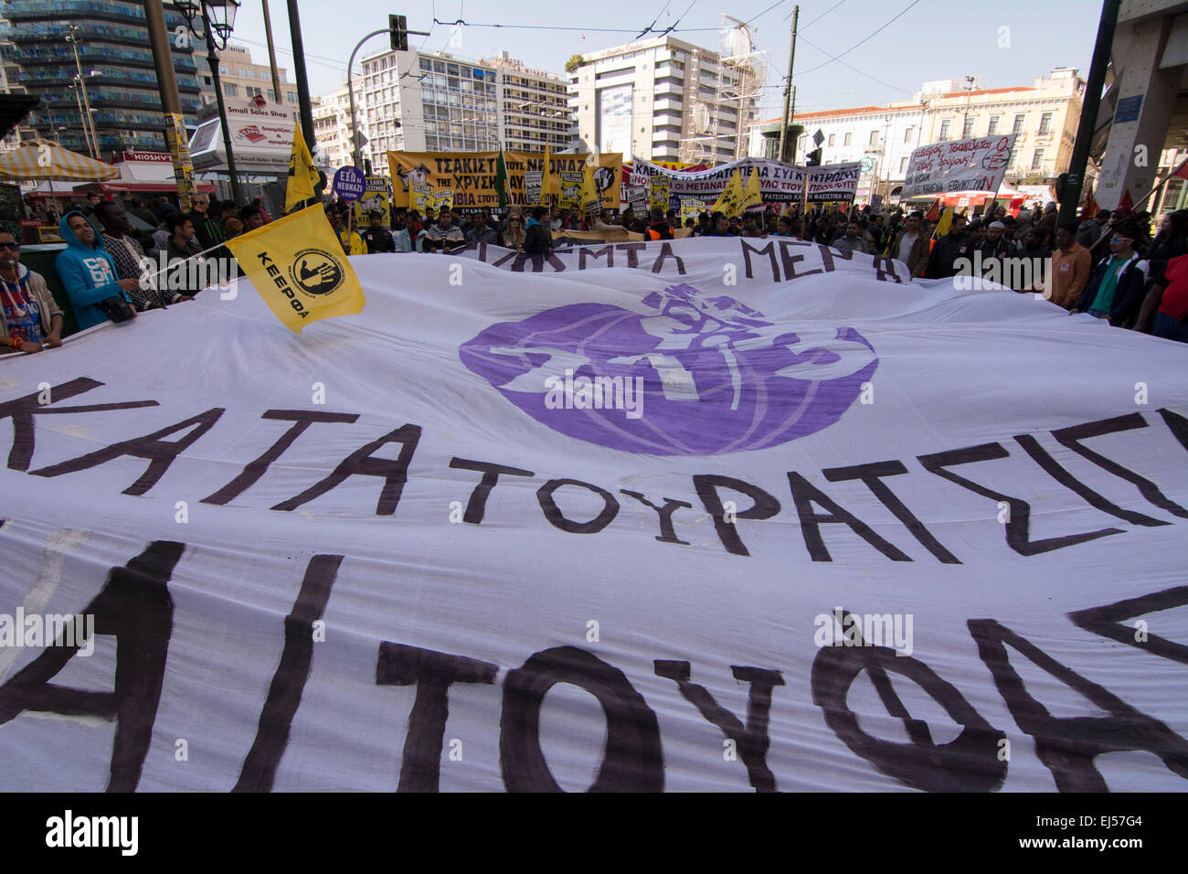 Athens, Greece, March 21, 2015. Activists march shouting slogans against racism and fascism on the International Day for the Elimination of Racial Discrimination. With racism on the rise in Greece and the neo-Nazi party Golden Dawn being the third force in parliament thousands took part in a rally organized by anti-racist organizations. Credit:  Nikolas Georgiou/Alamy Live News Stock Photo