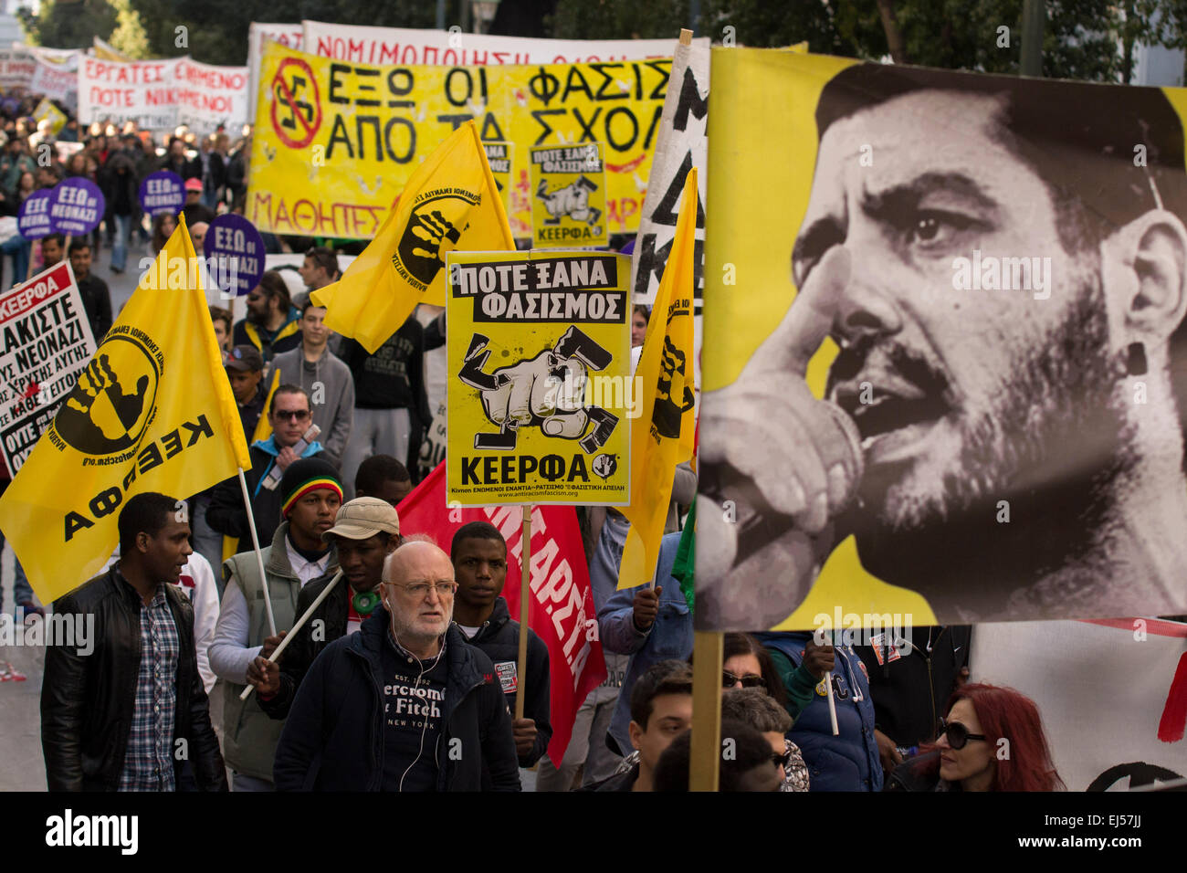 Athens, Greece, March 21, 2015. Activists march shouting slogans against racism and fascism on the International Day for the Elimination of Racial Discrimination. With racism on the rise in Greece and the neo-Nazi party Golden Dawn being the third force in parliament thousands took part in a rally organized by anti-racist organizations. Credit:  Nikolas Georgiou/Alamy Live News Stock Photo