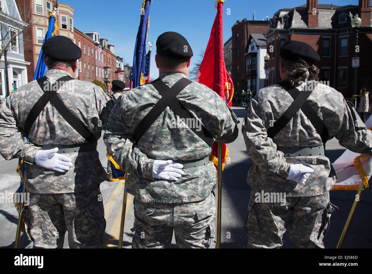 Backs of US Military Honor Guard at ease, St. Patrick's Day Parade, 2014, South Boston, Massachusetts, USA Stock Photo