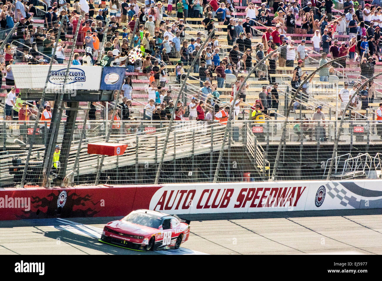 Fontana, CA, USA. 14th Mar, 2015. Fontana, CA - Mar 21, 2015: Kevin Harvick (88) crosses the finish line winning the Drive4Clots.com 300 at Auto Club Speedway in Fontana, CA. © csm/Alamy Live News Stock Photo