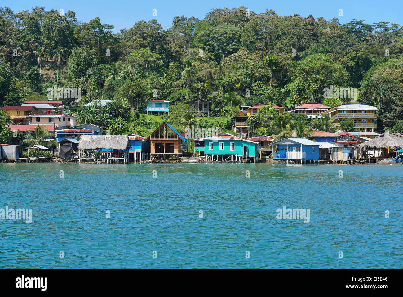 Coastal village of Old Bank with Caribbean houses and lush tropical vegetation, Bastimentos island, Bocas del Toro, Panama Stock Photo