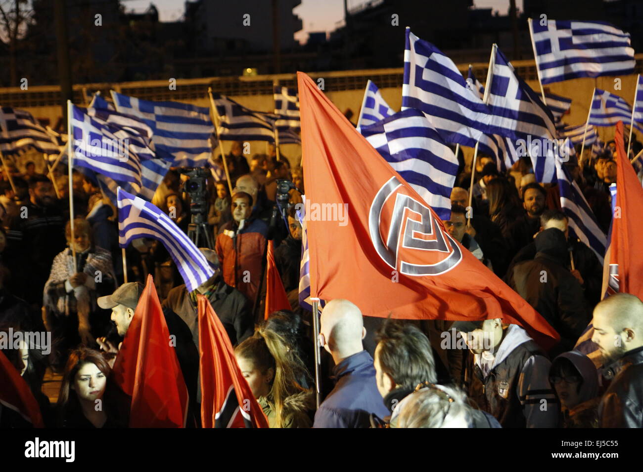 Athens, Greece. 21st Mar, 2015. Greek and Golden Dawn flags fly at the Golden Dawn rally. Greek right wing party Golden Dawn held an anti immigration rally on the International Day against Racism in Athens. © Michael Debets/Pacific Press/Alamy Live News Stock Photo