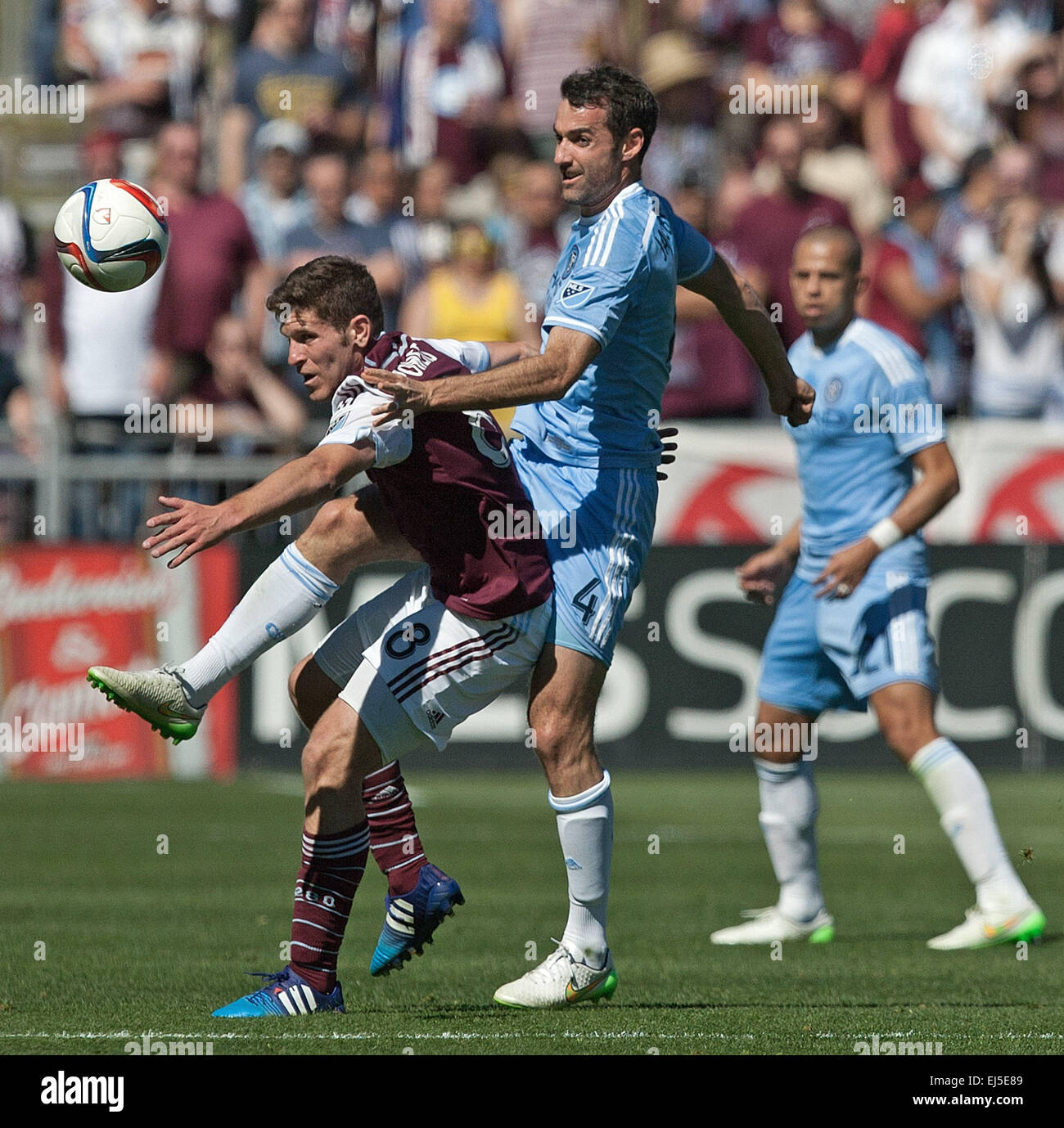 Commerce City, Colorado, USA. 21st Mar, 2015. Rapids MF DILLON POWERS, left, battles for control of the ball with NY MF ANDREW JACOBSON, center, during the 1st. Half at Dicks Sporting Goods Park during the Rapids Home Opener Saturday afternoon. Rapids & New York City FC draw to 0-0. © Hector Acevedo/ZUMA Wire/Alamy Live News Stock Photo