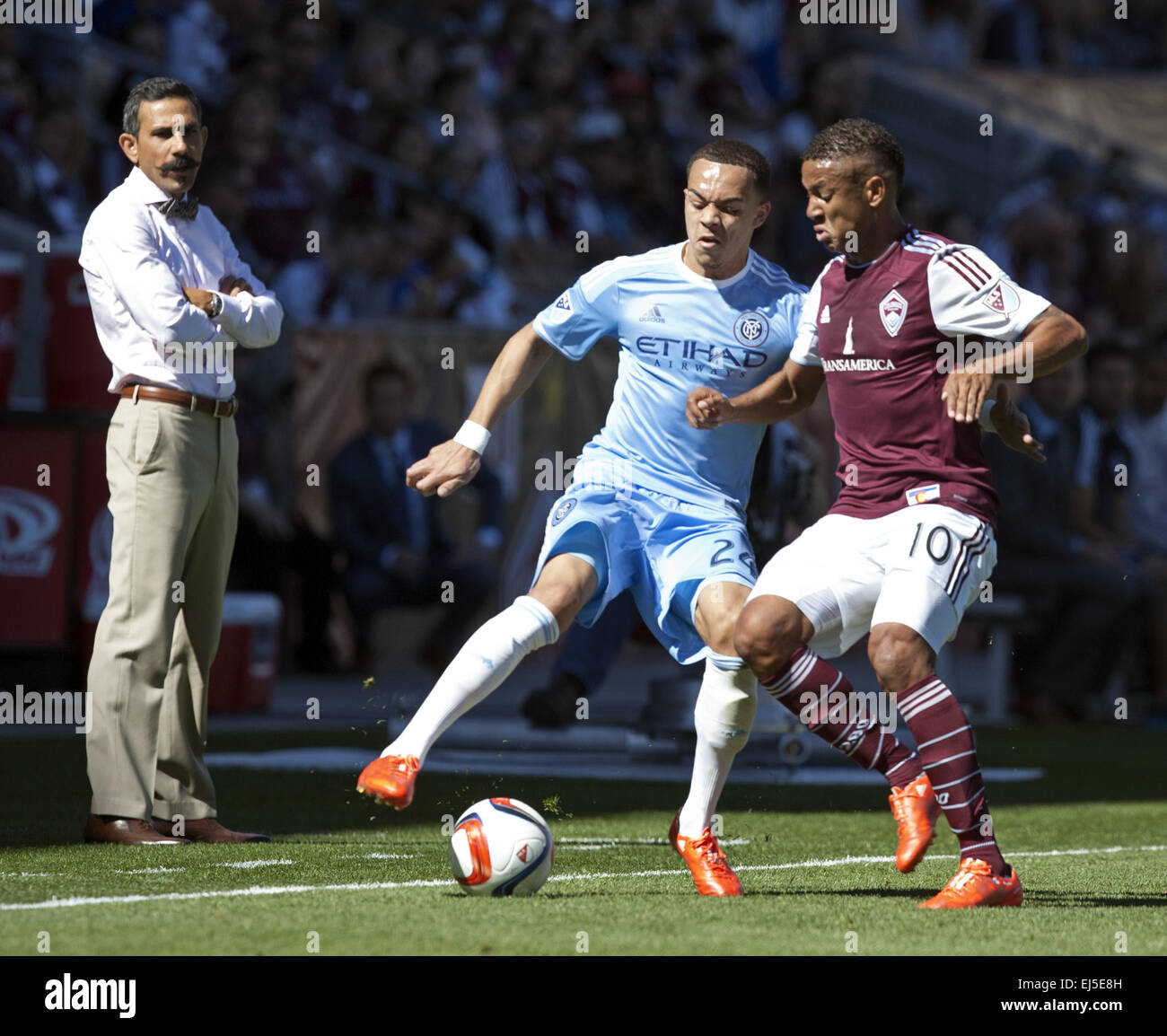 Commerce City, Colorado, USA. 21st Mar, 2015. NY D SHAY FACEY, left, battles for control of the ball with Rapids F GABRIEL TORRES, right, as Rapids Coach PABLO MASTOENI, far left, watches on during the 1st. Half at Dicks Sporting Goods Park during the Rapids Home Opener Saturday afternoon. Rapids & New York City FC draw to 0-0. © Hector Acevedo/ZUMA Wire/Alamy Live News Stock Photo