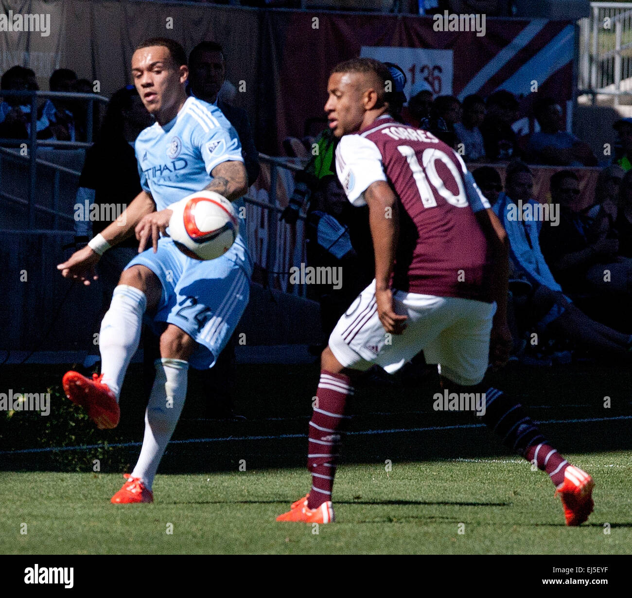 Commerce City, Colorado, USA. 21st Mar, 2015. NY City Mid. SABASTIAN VELASQUEZ, left, makes a pass to a team mate with Rapids F GABRIEL TORRES, right, defends during the 1st. Half at Dicks Sporting Goods Park during the Rapids Home Opener Saturday afternoon. Rapids & New York City FC draw to 0-0. © Hector Acevedo/ZUMA Wire/Alamy Live News Stock Photo
