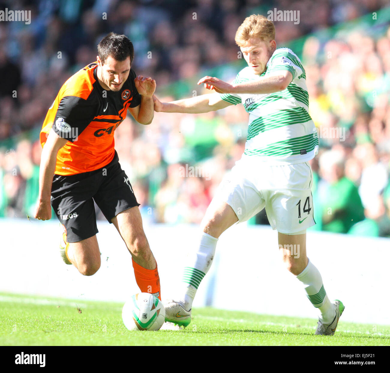 Glasgow, Scotland. 21st Mar, 2015. Scottish Premiership. Celtic versus Dundee United. Stuart Armstrong and Ryan McGowan tussle in midfield Credit:  Action Plus Sports/Alamy Live News Stock Photo