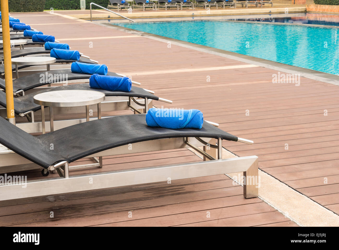 Swimming Pool and Daybeds ready for guests Stock Photo Alamy