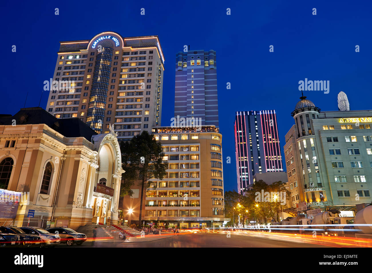 Buildings near Saigon Municipal Theater illuminated at night. Ho Chi Minh City, Vietnam. Stock Photo