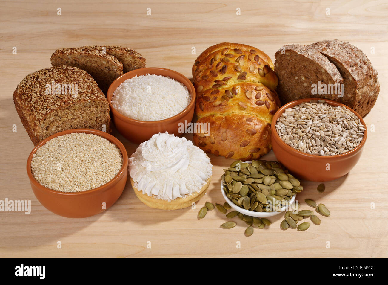Variety of bread and ingredients on wooden background Stock Photo - Alamy