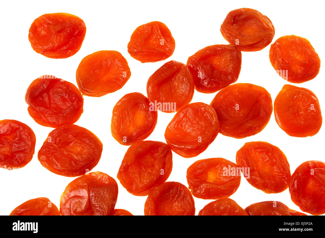Sun dried apricots isolated over white Stock Photo Alamy