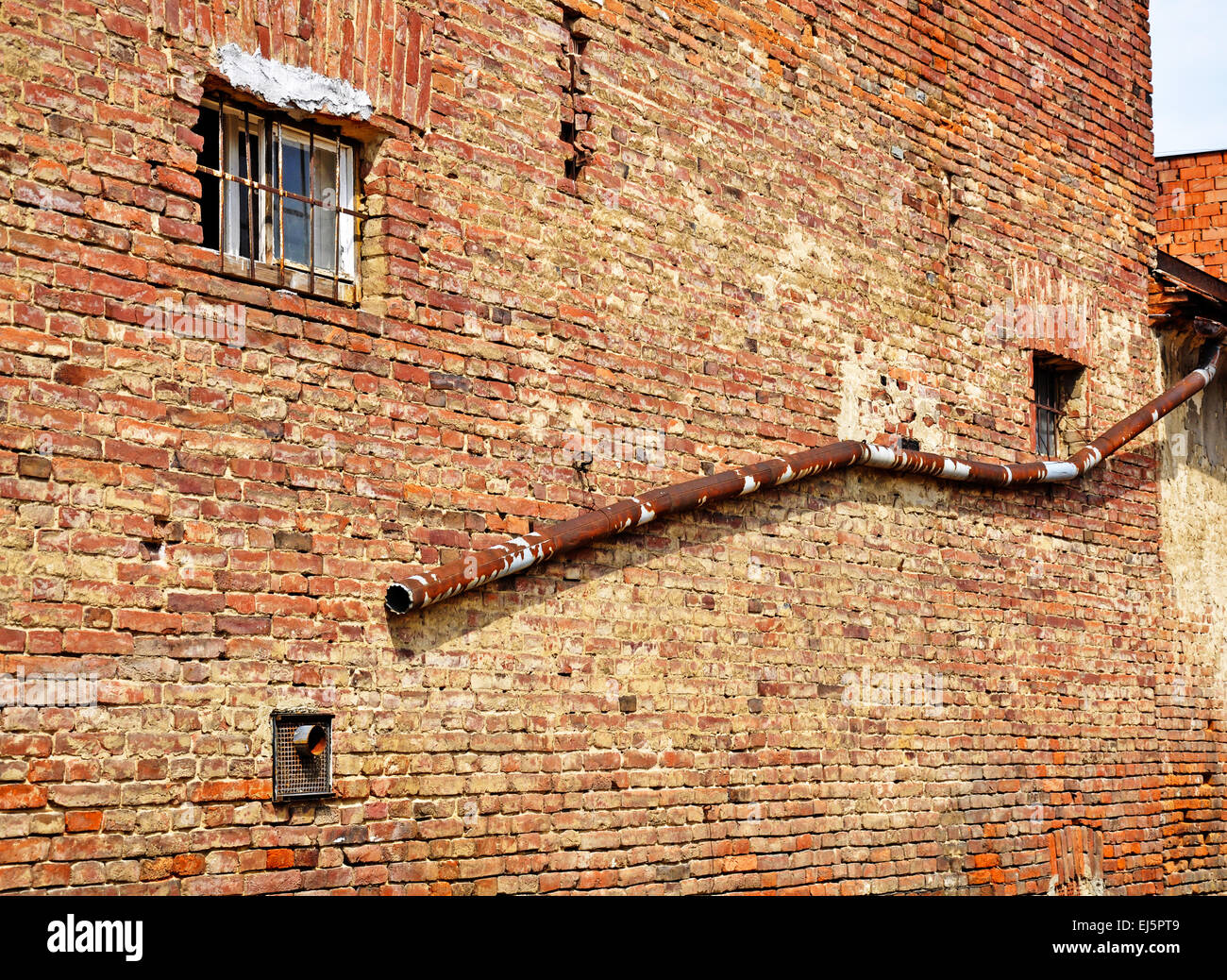 Old rundown brick wall and eaves pipe Stock Photo Alamy