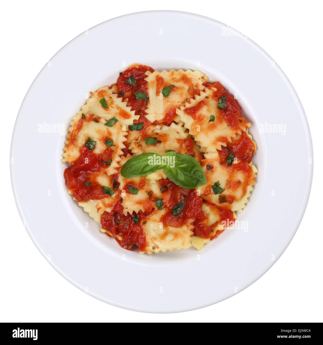 Italian Pasta Ravioli with tomato sauce noodles meal with basil on a plate isolated on a white background Stock Photo
