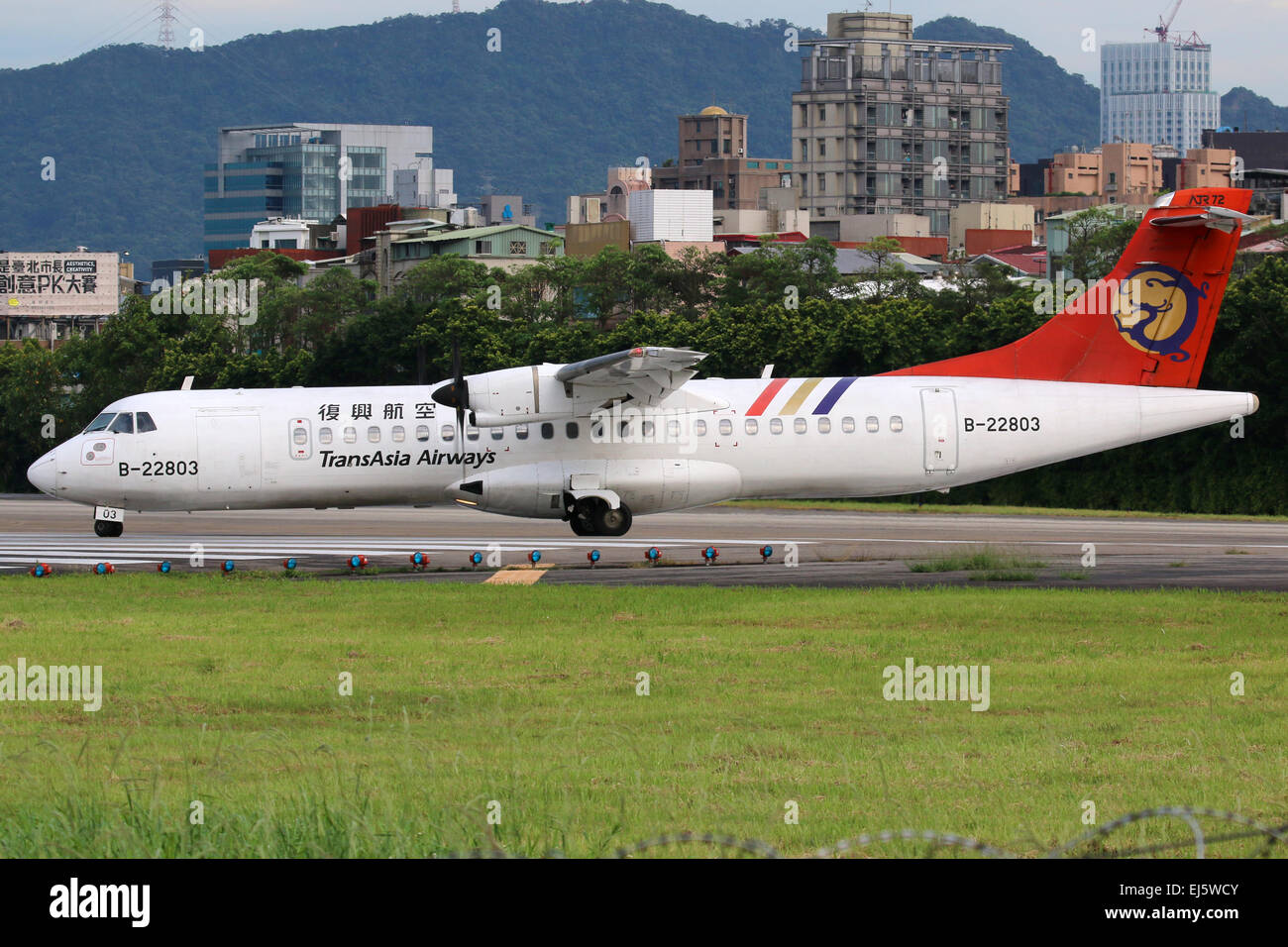Taipei, Taiwan - May 18, 2014: A TransAsia Airways ATR 72-500 with the registration B-22803 taxis at Taipei Songshan Airport (TS Stock Photo