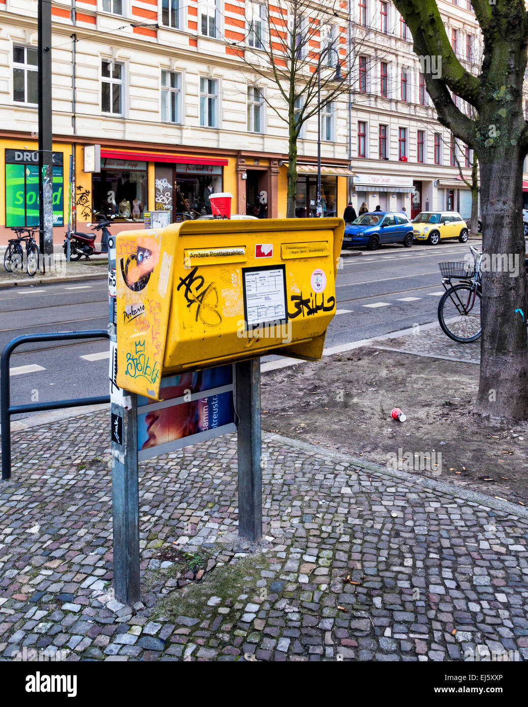 Berlin street and yellow post box, mail box Stock Photo - Alamy