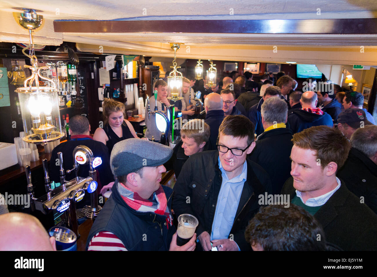 Rugby fan crowd / fans at crowded busy bar The Barmy Arms pub