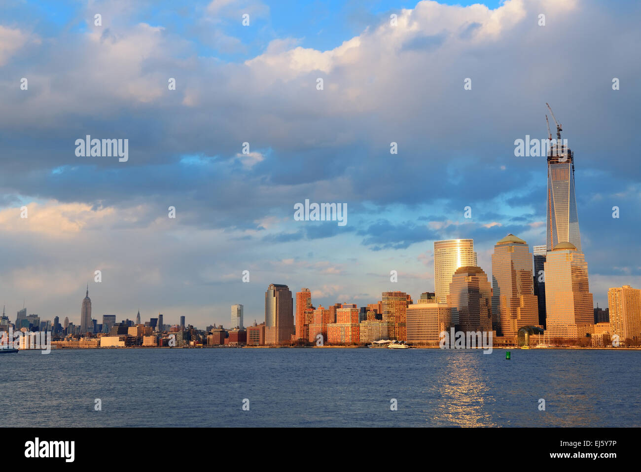 Downtown Manhattan skyline at sunset over Hudson River in New York City ...