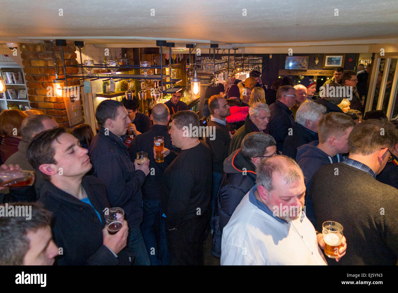 Rugby fan fans enjoy drinking / watching TV at the busy Prince Blucher pub / public house Twickenham. UK: popular on match days Stock Photo