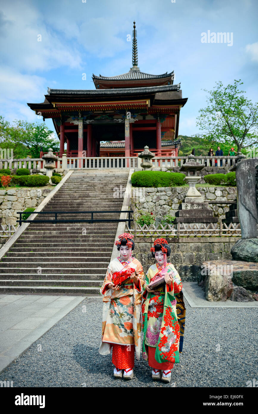 Geisha stand in Shrine in Kyoto, Japan Stock Photo