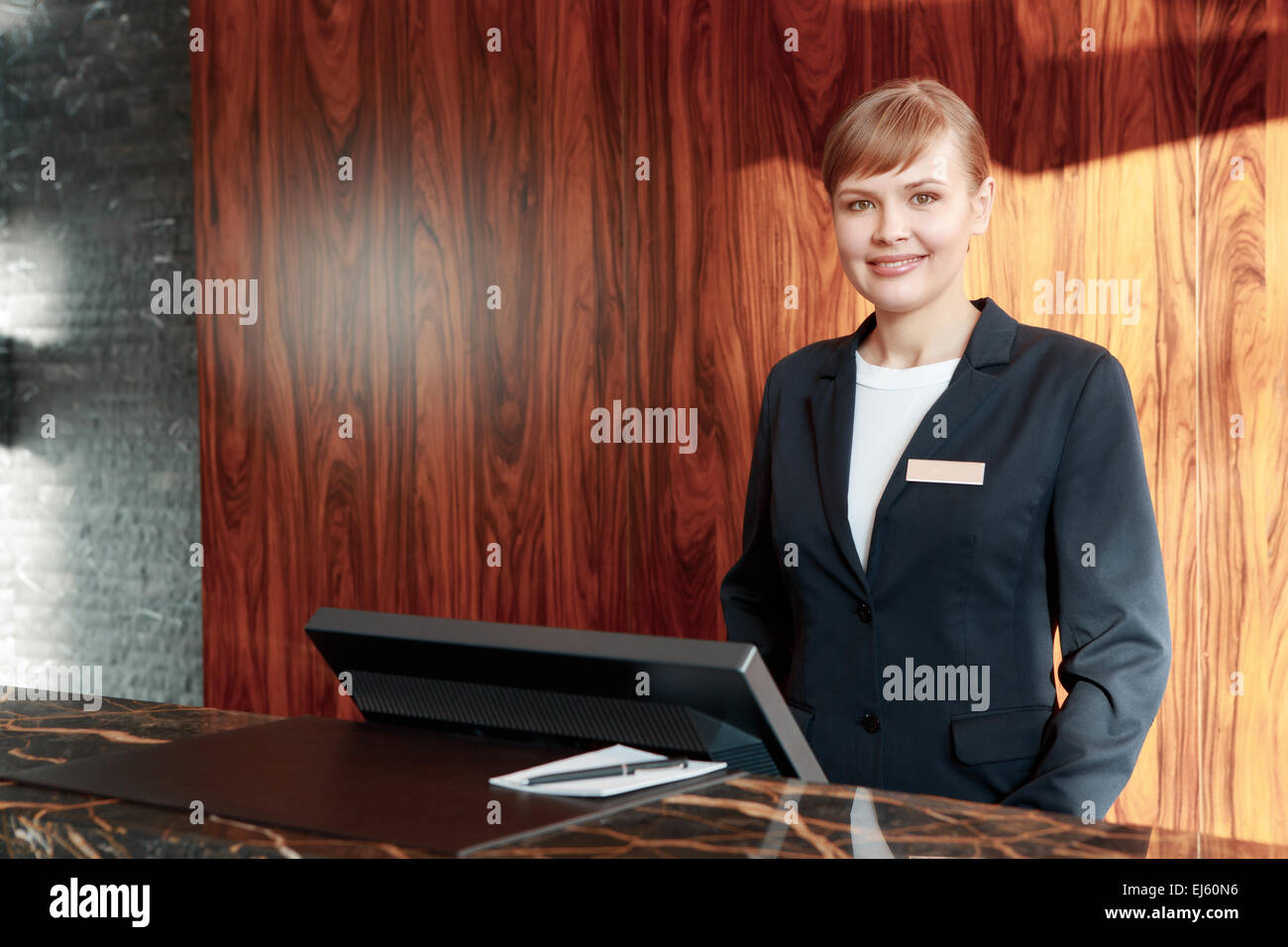 Charming receptionist at work Stock Photo