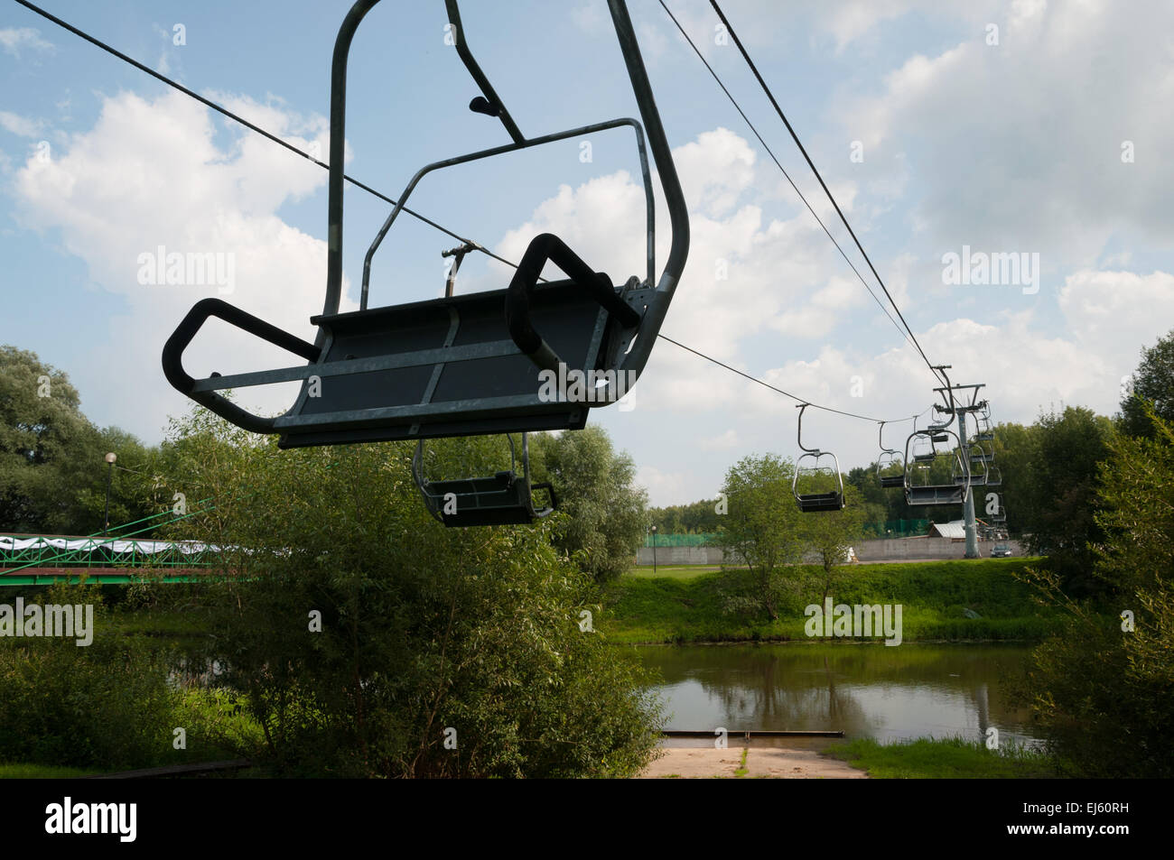 Aerial lift at ski resort in summer. Part of the lift over the river Stock Photo