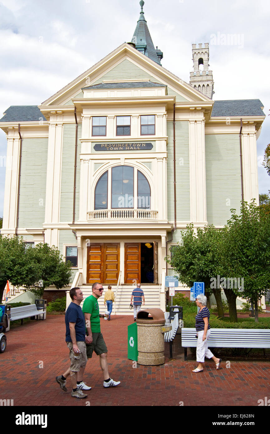 Provincetown town hall with tourists and men couple walking and holding hands. Cape Cod Massachusetts. Many gay tourist Stock Photo