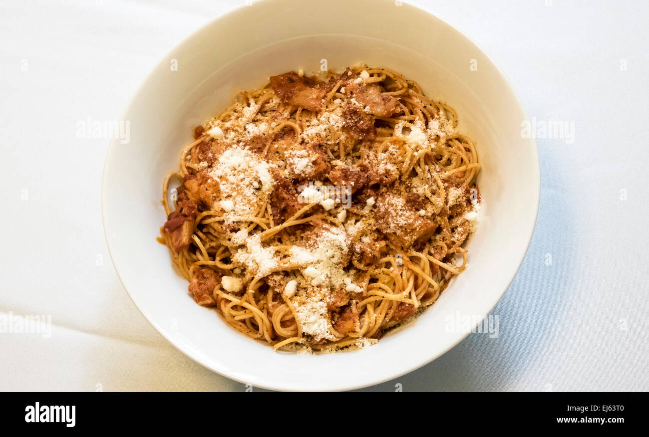 Spaghetti with tuna and bacon and tomato sauce with Pecorino Romano cheese Stock Photo