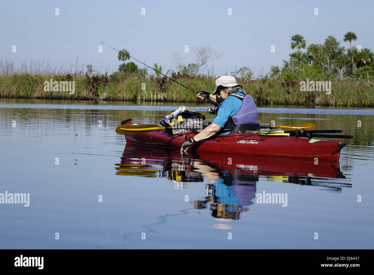 Halls River, Homosassa, Florida. Woman fishing from a kayak Stock Photo