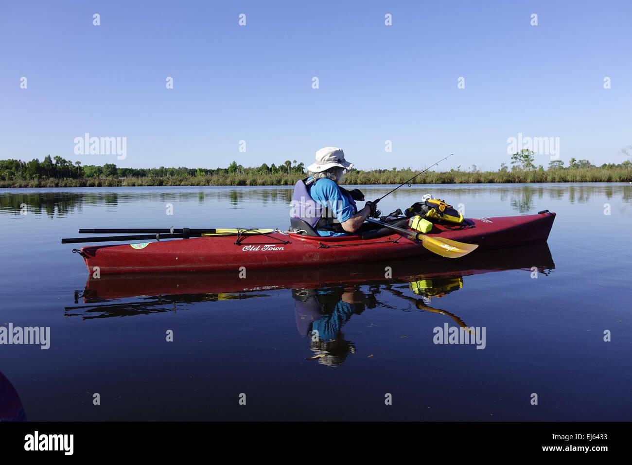 Halls River, Homosassa, Florida. Woman fishing from a kayak Stock Photo