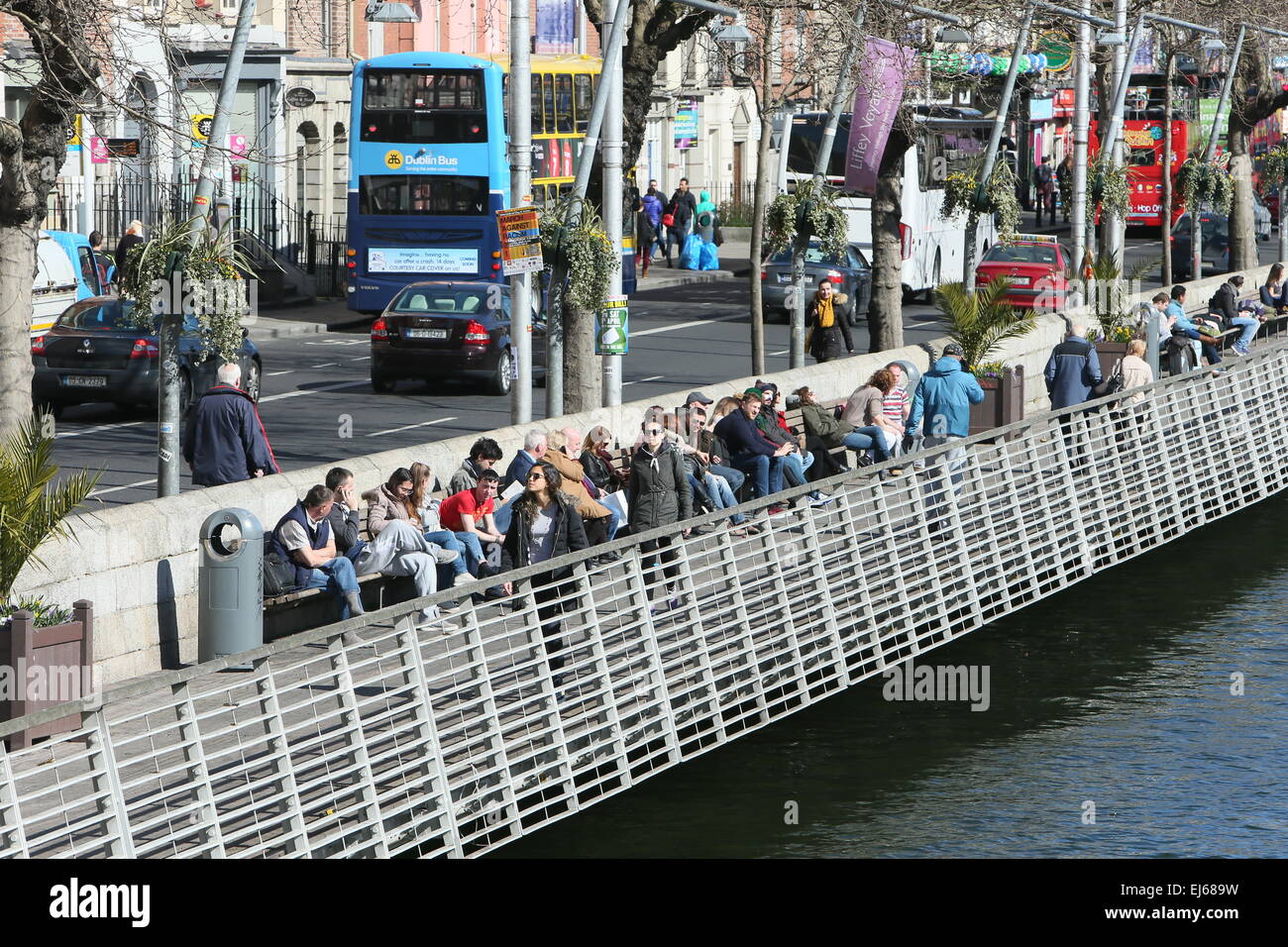 The boardwalk along the River Liffey in Dublin city centre on the first day of Spring as good weather creates a feel good factor Stock Photo