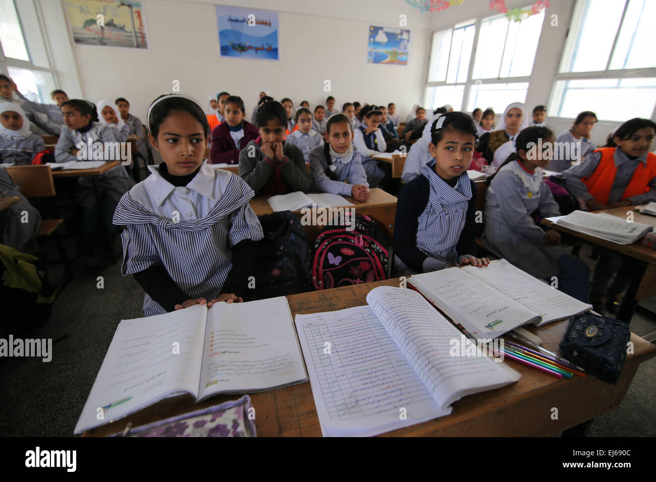 Gaza. 22nd Mar, 2015. Palestinian students attend a lesson at a UN-run school which is reopened after it was damaged during the war between Israel and Hamas militants in Khuzaa village of the southern Gaza Strip city of Khan Yunis, on March 22, 2015. © Khaled Omar/Xinhua/Alamy Live News Stock Photo