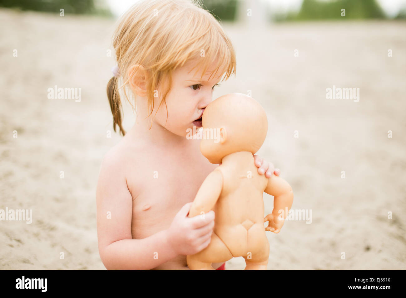 kissing baby doll