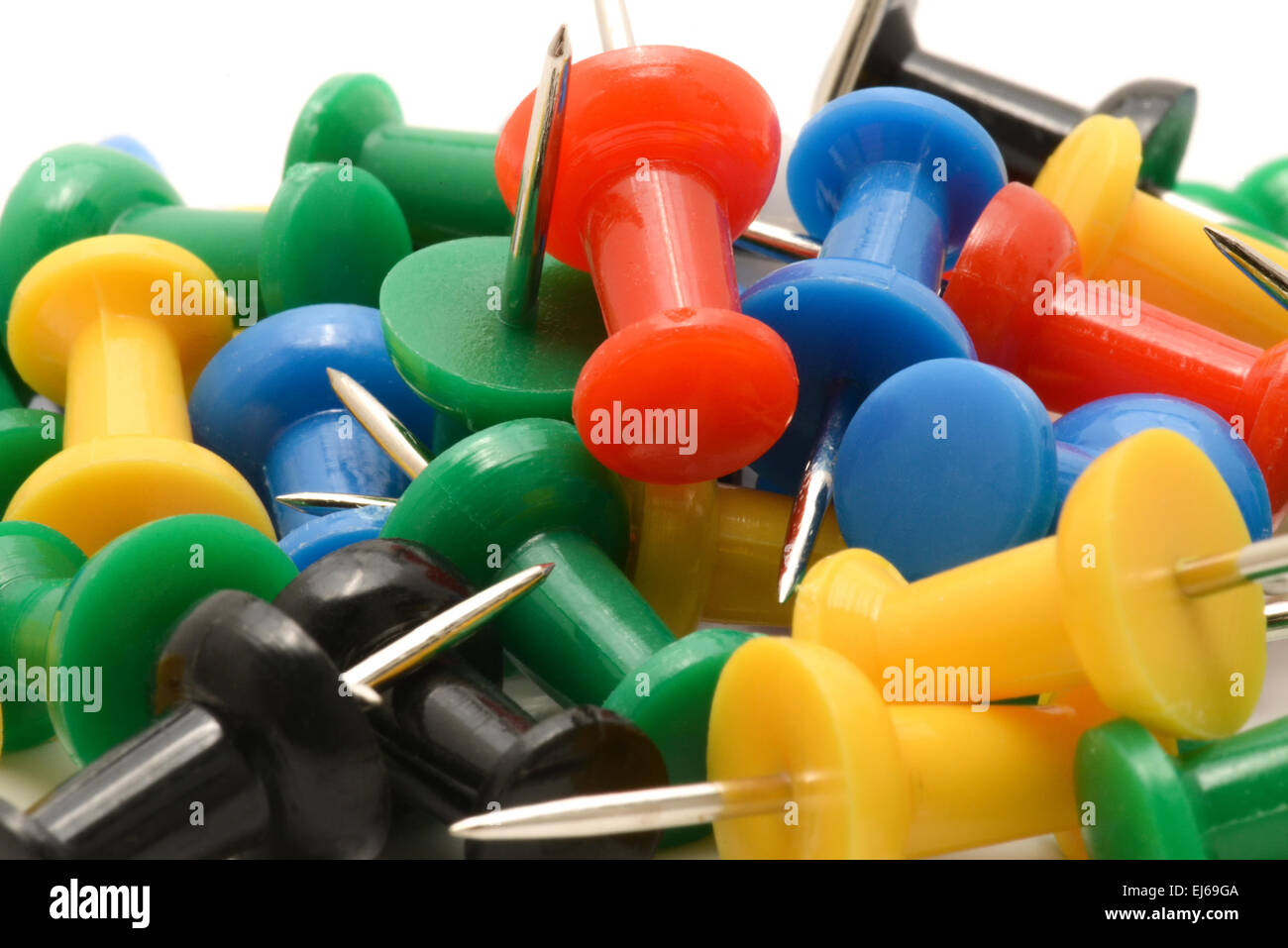 Macro of colorful push pins on white background Stock Photo - Alamy