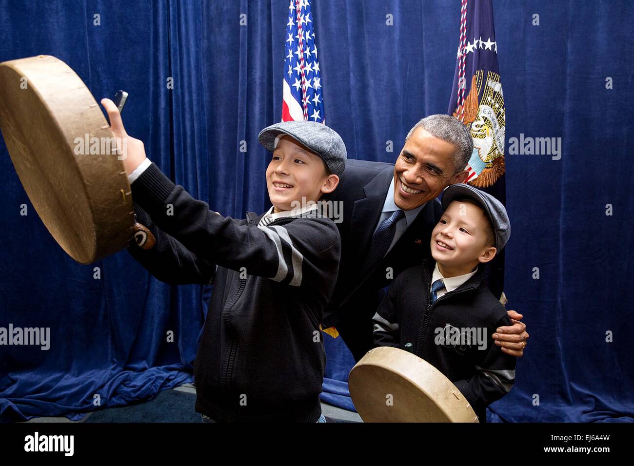 US President Barack Obama poses for a photo with children following his remarks at the White House Tribal Nations Conference December 3, 2014 in Washington, D.C. Stock Photo