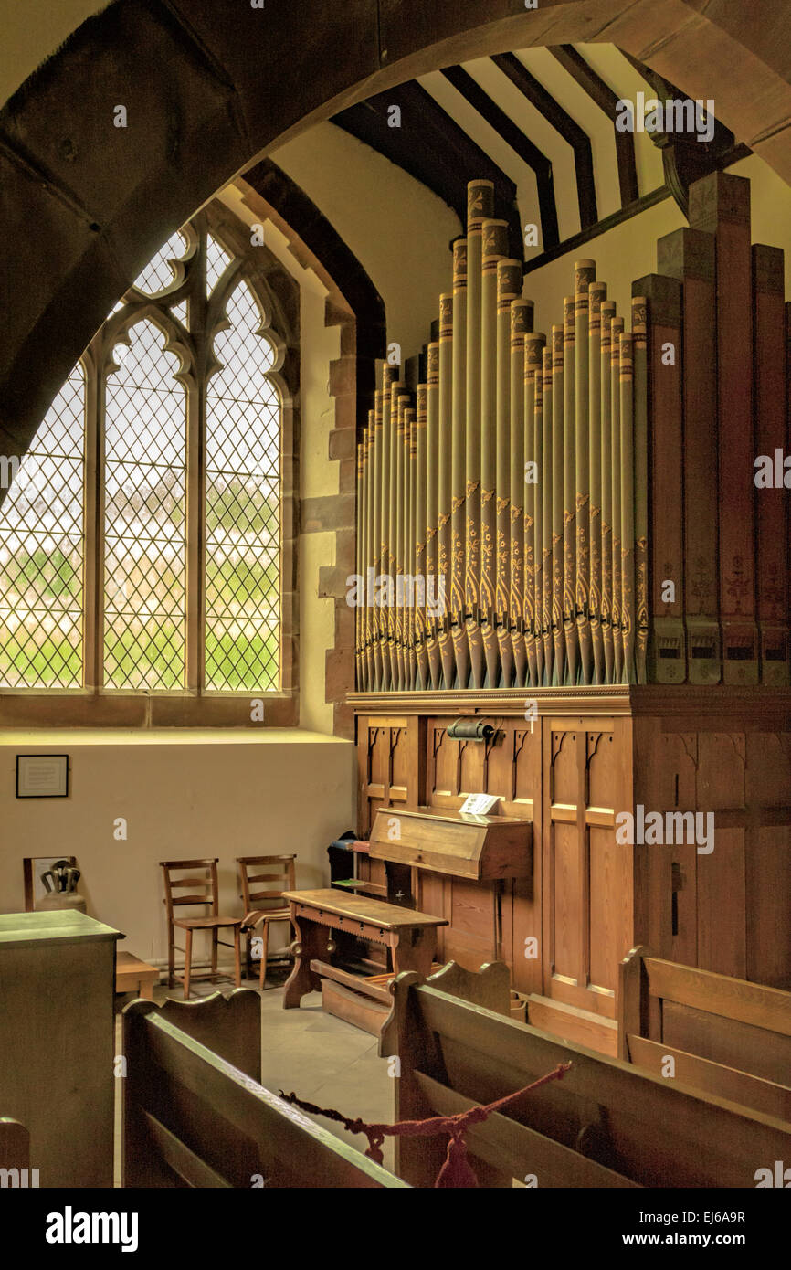 View on the single-manual pipe organ in St Michael’s Church, in the grounds of Muncaster Castle, Ravenglass, Cumbria, England Stock Photo