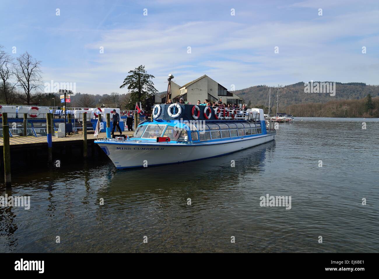 people getting on a cruise boat at bowness on windermere cumbria