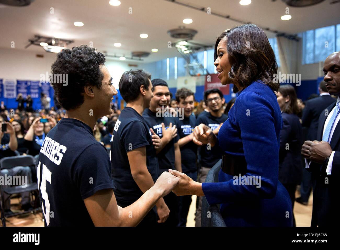 First Lady Michelle Obama talks with students during a college