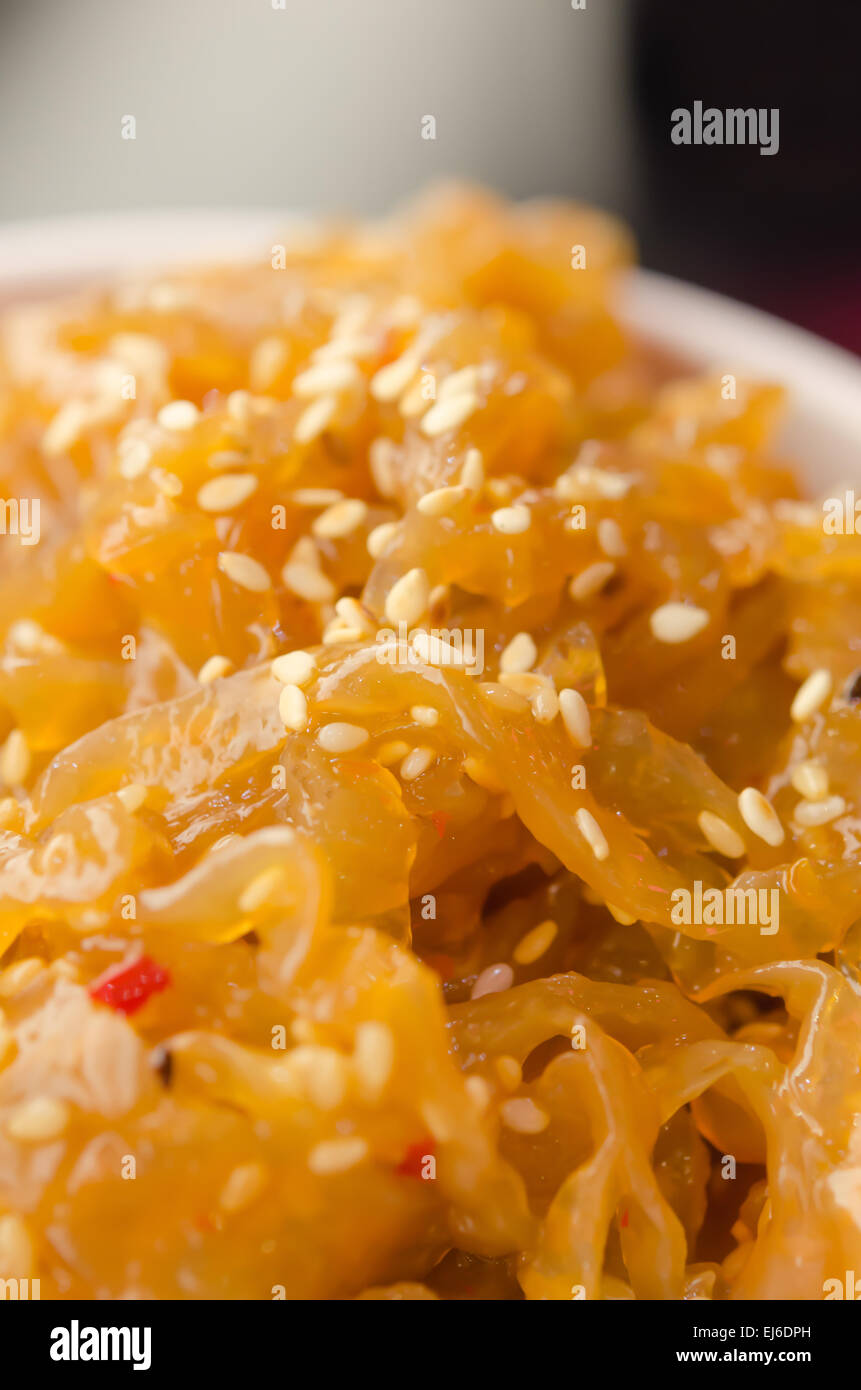 close up gourmet tossed jellyfish salad in white bowl , Chinese cuisine Stock Photo