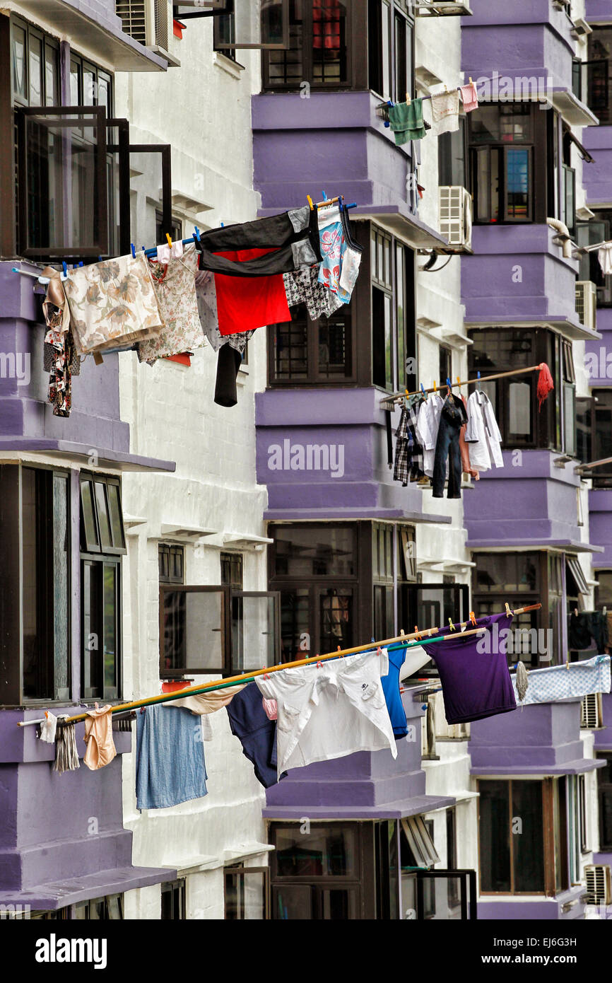 Laundry hanging on bamboo poles to dry in Chinatown in Singapore. Stock Photo