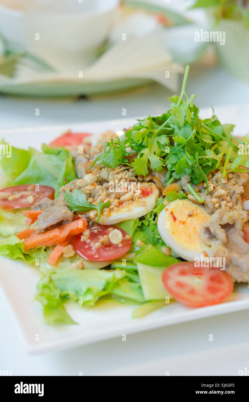 spicy salad with egg , pork and fresh vegetable Stock Photo